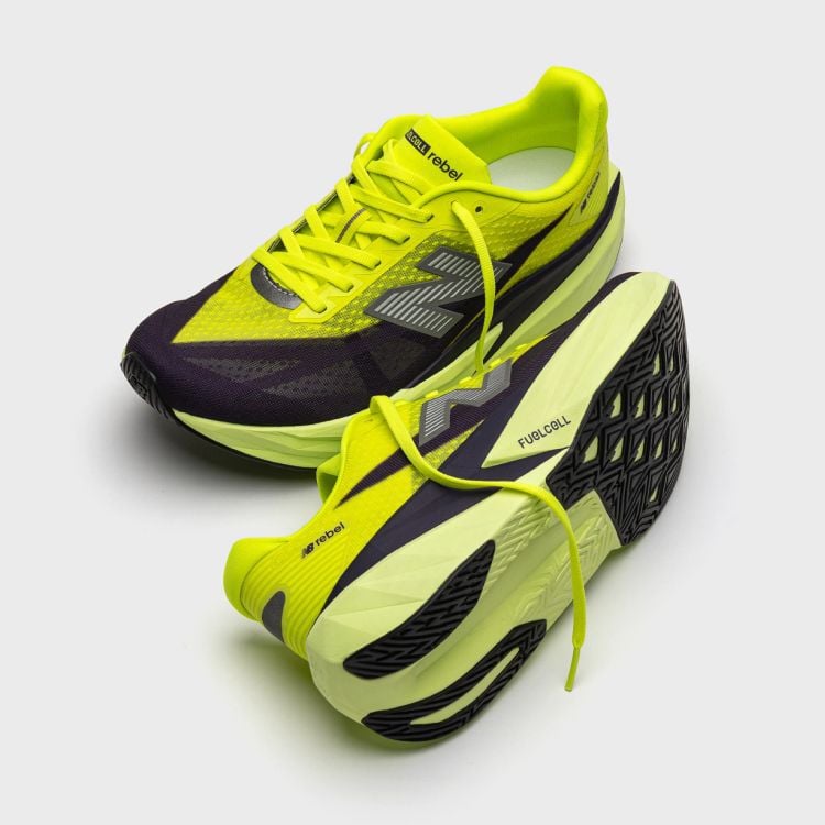 A pair of green and black FuelCell Rebel v5 shoes. 